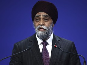 Canada is being hailed for funding initiatives in developing countries that aim to keep women who care for children or elders from being excluded from the economy. Canada's Minister of International Development Harjit Sajjan speaks at the Ukraine Recovery Conference in London, Wednesday, June 21, 2023.