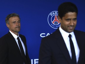 Newly named PSG coach Luis Enrique, left, follows PSG president Nasser Al-Khelaifi at the new Paris-Saint-Germain training ground Wednesday, July 5, 2023 in Poissy, west of Paris. Paris Saint-Germain fired coach Christophe Galtier after a disappointing season on and replaced him with former Spain and Barcelona manager Luis Enrique.