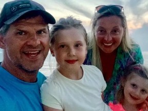 Caroline Huebner-Makurat (rear and to the right) is pictured with her family in the GoFundMe photo.