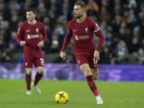 FILE - Liverpool's Jordan Henderson plays the ball during the team's English Premier League soccer match against Brighton in Brighton, England, Jan. 14, 2023. Henderson was a notable absentee as Liverpool beat Karlsruher 4-2 in a preseason friendly Wednesday, July 19, as the England midfielder closes in on a move to Saudi Arabian team Al-Ettifaq. Liverpool has reportedly agreed in principle a deal worth 12 million pounds ($15.5 million) for its Premier League and Champions League-winning captain.