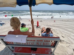 Lifeguards watch bathers on Long Beach July 21, 2022 in Long Beach, N.Y.