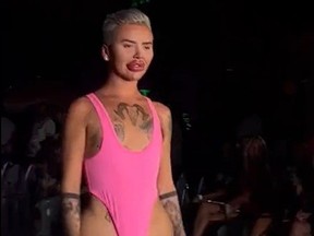Male modelling womens pink swimsuit at Miami Swim Week 2023.