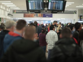 People wait in the arrivals area at Benito Juarez International Airport on Dec. 21, 2020 in Mexico City.