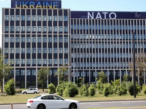 Banners reading 'Ukraine' and 'NATO' are seen on the NATO Summit venue in Vilnius, Lithuania
