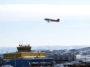 A plane takes off from the Iqaluit airport Saturday, April 25, 2015 in Iqaluit, Nunavut. AArctic security is under renewed focus as Russia and China eye the region, but leaders in the North say Canada won't be able to exert sovereignty if their communities aren't built up properly.
