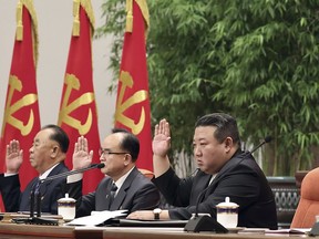 North Korean leader Kim Jong Un, centre, attends a meeting