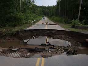 Damage to a washed-out roadway is pictured near McKay Section, N.S. on Sunday, July 23, 2023. A long procession of intense thunderstorms dumped record amounts of rain across a wide swath of Nova Scotia, causing flash flooding, road washouts and power outages.
