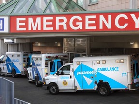 Ambulances are seen at a hospital in Toronto on Tuesday, April 6, 2021.