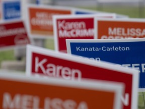 Campaign signs for provincial byelections in the riding of Kanata-Carleton are seen, Thursday, July 20, 2023 in Ottawa.