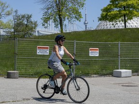 A cyclist turns around a closed pathway at Ontario Place in Toronto, May 29, 2023.