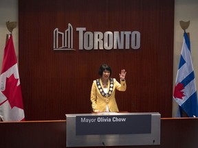 Newly elected Mayor Olivia Chow waves to the crowd at council chambers during her Declaration of Office Ceremony, at Toronto City Hall on July 12, 2023.