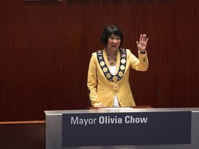 Newly elected Mayor Olivia Chow waves to the crowd at council chambers during her Declaration of Office Ceremony, at Toronto City Hall on July 12, 2023.