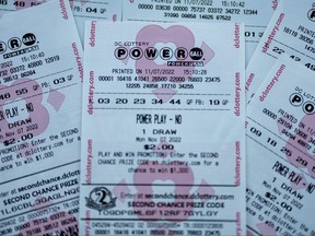 In this photo illustration, tickets for the upcoming Powerball lottery are seen