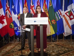 Manitoba Premier Heather Stefanson, who chairs the Council of the Federation, speaks to media as Quebec Premier François Legault listens at the annual premiers meeting at The Fort Garry Hotel in Winnipeg, Tuesday, July 11, 2023.