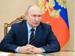Russian President Vladimir Putin holds an online Russia's Security Council meeting in Moscow