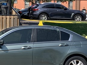 Bullet holes are visible on the top of this grey car parked in front of the Orpington Cres. townhouse complex where a shooting killed a 25-year-old man on Wednesday, July 19. 2023.