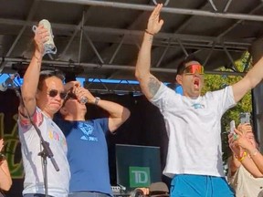 A screenshot of a video of Vancouver Mayor Ken Sim, Coun. Mike Klassen, and a third person shotgunning beers at the Khatsahlano Streety Party on the weekend.