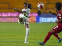 Just 22, Jayde Riviere already has a glittering soccer resume and a star in the rise. Riviere, left, kicks the ball past Panama's Marta Cox during a CONCACAF Women's Championship soccer match in Monterrey, Mexico, Friday, July 8, 2022.
