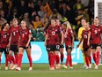 Canada's Christine Sinclair (12) and teammates react after conceding the second goal of the first half during Group B soccer action against Australia at the FIFA Women's World Cup in Melbourne, Australia, Monday, July 31, 2023. Captain Sinclair refused to point the finger at Canada Soccer in the immediate aftermath of Olympic champion Canadians' early exit from the FIFA Women's World Cup.