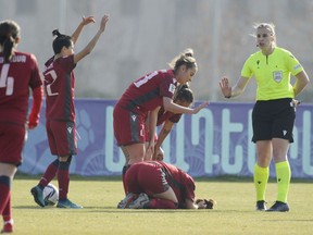 Referee Victoria Beyer of France, right, gestures as Armenia's players react during the group F, Women's World Cup 2023 qualifying soccer match between Armenia and Norway at the FFA Academy stadium in Yerevan, Armenia, Wednesday, Dec. 1, 2021.
