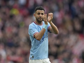 Manchester City's Riyad Mahrez applauds the fans after the end of the English FA Cup semifinal between Manchester City and Sheffield United at Wembley Stadium in London, Saturday, April 22, 2023. Riyad Mahrez is the latest Premier League player to head to Saudi Arabia after signing with Al-Ahli. The Algeria international was a key player in Leicester's shocking title win in 2016 and then won the league four more times with Manchester City.