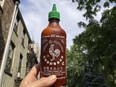 A bottle of Sriracha chili sauce is shown in New York on Thursday, July 13, 2023.