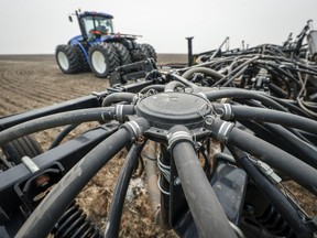 A seeding rig is readied to plant a canola crop on a farm near Cremona, Alta., Tuesday, May 16, 2023. Statistics Canada says the country posted a merchandise trade deficit of $3.4 billion in May, the largest deficit since October 2020.THE CANADIAN PRESS/Jeff McIntosh