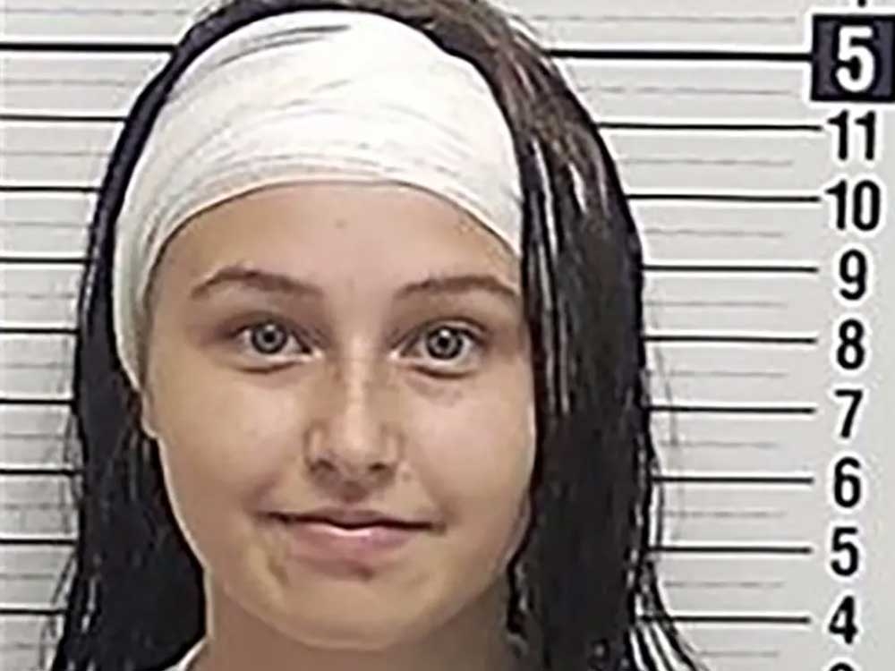 Florida teen smiles in mugshot after part of her ear was bitten off in an alleged brawl