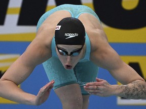 Veteran Canadian swimmers Sydney Pickrem and Mabel Zavaros have pulled out of the upcoming World Aquatics Championships in Fukuoka, Japan. Pickrem is shown in this Dec. 16, 2022 file photo starting her heat at the women's 200m breaststroke during the world swimming short course championships in Melbourne, Australia.