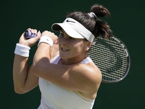 Canada's Bianca Andreescu returns to Ukraine's Anhelina Kalinina in a women's singles match on day five of the Wimbledon tennis championships in London, Friday, July 7, 2023.