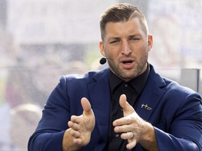 FILE - SEC Nation host Tim Tebow talks to his co-hosts during the SEC Nation broadcast in Lexington, Ky., Saturday, Oct. 9, 2021. Tim Tebow will be part of an ownership group bringing an expansion hockey team to Lake Tahoe, the ECHL announced Monday, July 10, 2023.