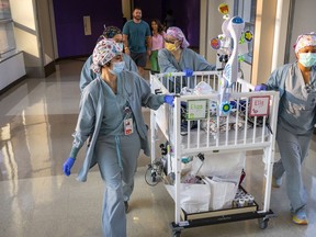 Texas Children's Hospital doctors take Eliza Fuller to the NICU after she was separated from twin sister Ella.