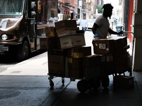 A UPS worker makes deliveries in Manhattan