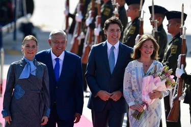 Mexican President Andres Manuel Lopez Obrador (2-L) and Mexican First Lady Beatriz Gutierrez Muller (L) welcomed Canadian Prime Minister Justin Trudeau (2-R) and his wife Sophie Grégoire (R) at Felipe Angeles International Airport in Santa Lucia, Mexico, on January 9, 2023. (Photo by CLAUDIO CRUZ/AFP via Getty Images)