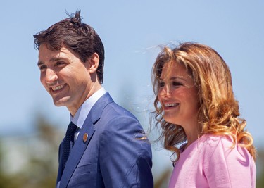 In this file photo taken on June 08, 2018 Prime Minister of Canada Justin Trudeau and his wife Sophie Gregoire Trudeau arrive for a welcome ceremony for G7 leaders on the first day of the summit in La Malbaie, Quebec. (Photo by GEOFF ROBINS/AFP via Getty Images)