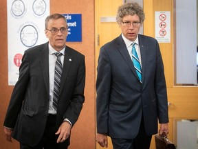Quebec English School Boards Association president Dan Lamoureux, left, and executive director Russell Copeman leave the courtroom during a hearing on Bill 40 on Tuesday June 23, 2020.