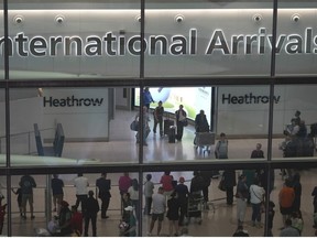 Passengers arrive at the Heathrow Airport