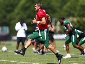 Quarterback Aaron Rodgers of the New York Jets runs during training camp.