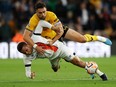 Carlton Morris of Luton Town and Max Kilman of Wolverhampton Wanderers battle for possession.