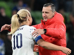 U.S. coach Vlatko Andonovski (right) comforts midfielder Lindsey Horan at the Women's World Cup.