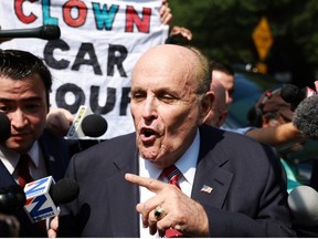 Rudy Giuliani speaks to the media