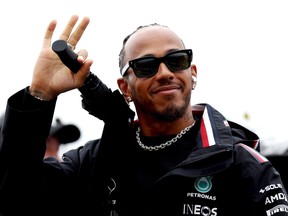 Lewis Hamilton of Great Britain and Mercedes waves