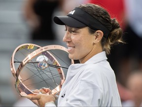 Jessica Pegula from the United States poses with the trophy after winning the final of the National Bank Open tennis tournament against Liudmila Samsonova from Russia in Montreal, Sunday, Aug. 13, 2023.