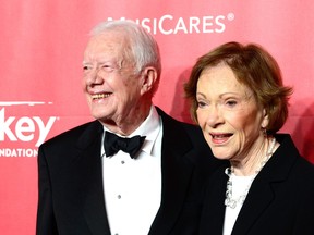 Former U.S. President Jimmy Carter (L) and former First Lady Rosalynn Carter