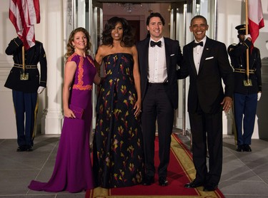 US President Barack Obama (R) and First Lady Michelle Obama (2nd L), Canadian Prime Minister Justin Trudeau (2nd R) and his wife Sophie Gregoire Trudeau pose upon the Trudeau's arrival for a State Dinner in their honor at the White House in Washington, DC, on March 10, 2016. NICHOLAS KAMM/AFP/Getty Images