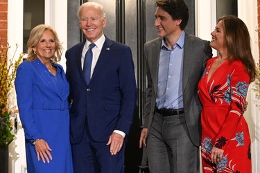TOPSHOT - Canadian Prime Minister Justin Trudeau and his wife Sophie Gr?goire Trudeau greet US President Joe Biden and First Lady Jill Biden as they arrive at Rideau Cottage, the Prime Ministers Residence, on March 23, 2023, in Ottawa, Canada. (Photo by Mandel NGAN / AFP) (Photo by MANDEL NGAN/AFP via Getty Images)