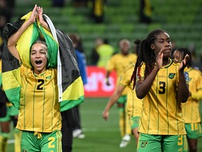 Jamaica's midfielder #02 Solai Washington (L) and Jamaica's defender #03 Vyan Sampson celebrate after their team qualified for the last 16 following the Australia and New Zealand 2023 Women's World Cup Group F football match between Jamaica and Brazil at Melbourne Rectangular Stadium, also known as AAMI Park, in Melbourne on August 2, 2023. (Photo by WILLIAM WEST / AFP) (Photo by WILLIAM WEST/AFP via Getty Images)