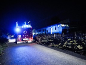 Rescue vehicles are seen along the railway outside the train station of Brandizzo where five railway workers died after being hit by a train during overnight maintenance on August 31, 2023.