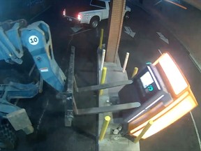 Forklift knocks over ATM machine