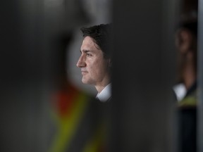 Prime Minister Justin Trudeau looks on during a visit to an apartment complex under construction in Hamilton Monday, July 31, 2023.